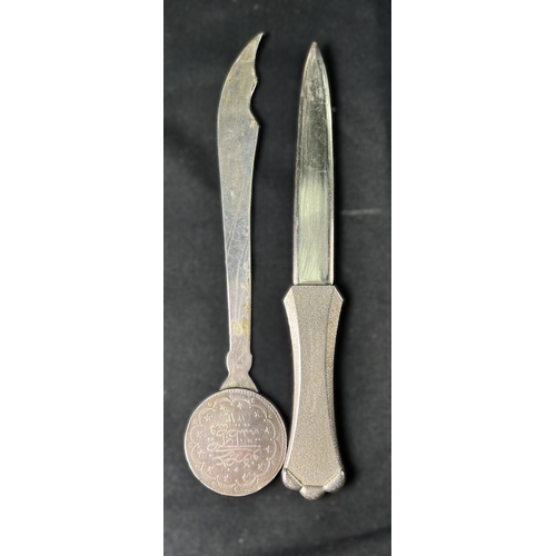 51 - A brass desk lamp, middle Eastern white metal letter opener, desk set etc