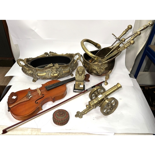 68 - A brass planter, brass canon, Pharaoh bust, Art Deco style lamp etc