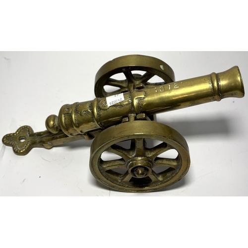 68 - A brass planter, brass canon, Pharaoh bust, Art Deco style lamp etc