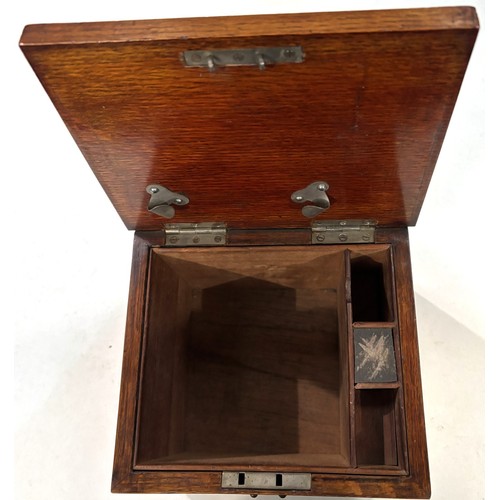 288A - A 1930's oak cigar humidor with brass fittings , match striking interior