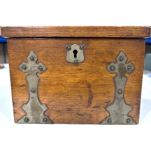 288A - A 1930's oak cigar humidor with brass fittings , match striking interior