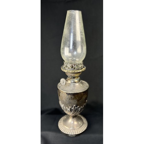 616C - A hallmarked silver oil lamp with gadrooned lower body and pedestal  base, London 1894, Weighted bas... 