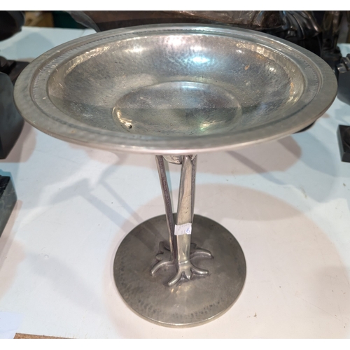 83B - A circular Arts and Craft tall planished pewter comport on triple stem lettered A M & Co, Englis... 