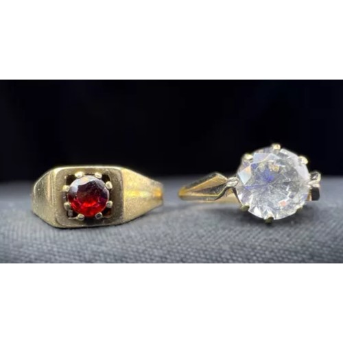 599A - Two 9 carat gold dress rings, garnet and clear stone set, 3.7gms.