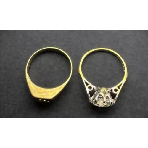 599A - Two 9 carat gold dress rings, garnet and clear stone set, 3.7gms.