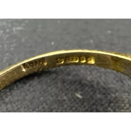 599A - Two 9 carat gold dress rings, garnet and clear stone set, 3.7gms.