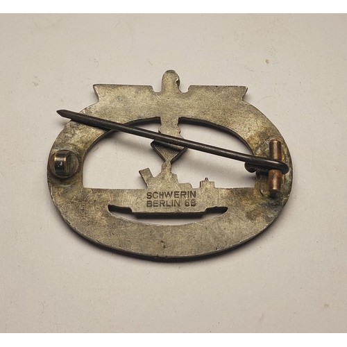 190A - A WWII period German U-boat Kriegsmarine badge, marked Schwerin to the reverse, and a reproduction c... 