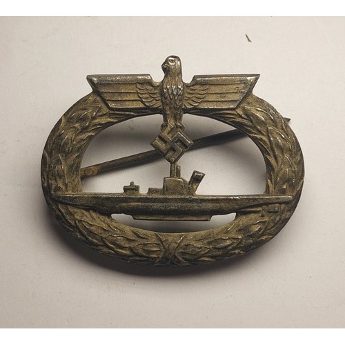 190A - A WWII period German U-boat Kriegsmarine badge, marked Schwerin to the reverse, and a reproduction c... 