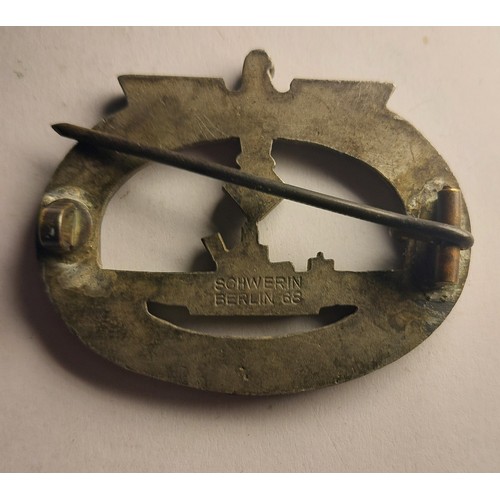190A - A WWII period German U-boat Kriegsmarine badge, marked Schwerin to the reverse, and a reproduction c... 