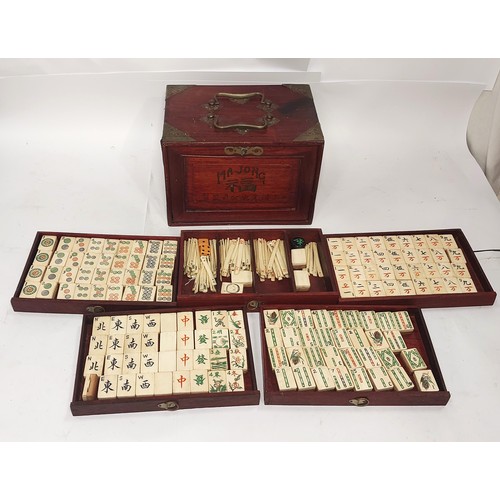 301 - A vintage Mahjong set, boxed; 2 large conch shells, other games etc.