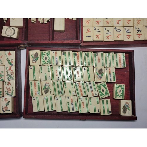 301 - A vintage Mahjong set, boxed; 2 large conch shells, other games etc.