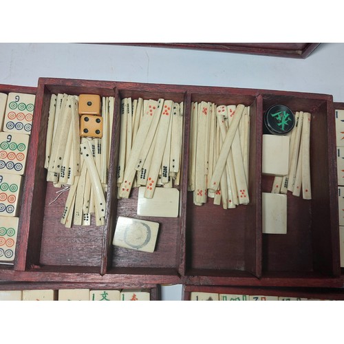 301 - A vintage Mahjong set, boxed; 2 large conch shells, other games etc.