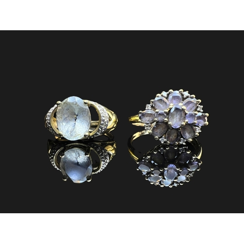 A 9 carat hallmarked gold dress ring set oval pale grey stone and illusion  set diamond chips to shou