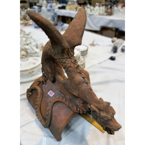 5 - An oriental terracotta garden roof tile in the form of a dragon.