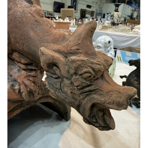 5 - An oriental terracotta garden roof tile in the form of a dragon.