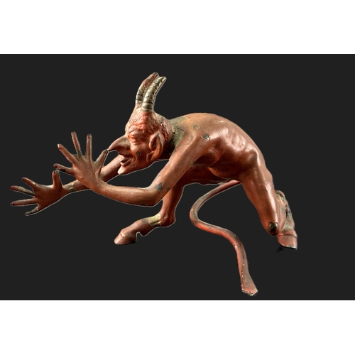 20 - A 19th century cold painted bronze of the devil (leg a.f) length 13cm.