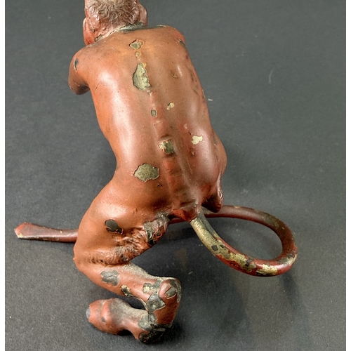20 - A 19th century cold painted bronze of the devil (leg a.f) length 13cm.