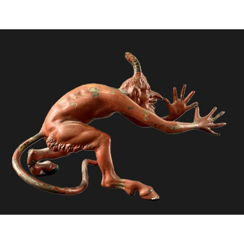 20 - A 19th century cold painted bronze of the devil (leg a.f) length 13cm.