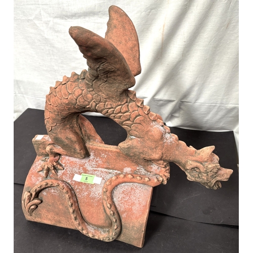5 - An oriental terracotta garden roof tile in the form of a dragon.