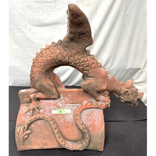 5 - An oriental terracotta garden roof tile in the form of a dragon.