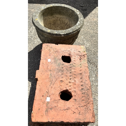 5A - A terracotta garden shelf with acanthus decoration, a reconstituted stoneware jardinière
