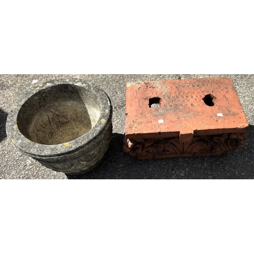 5A - A terracotta garden shelf with acanthus decoration, a reconstituted stoneware jardinière