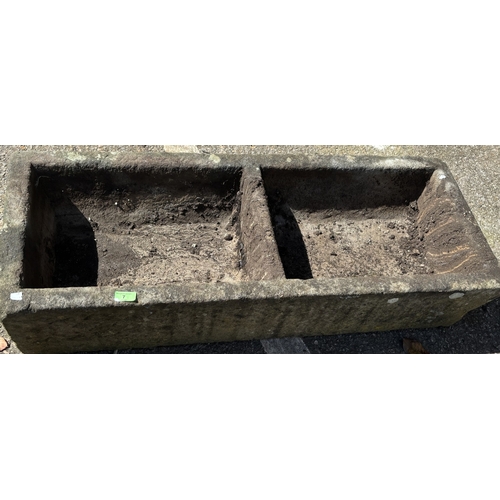 7 - A stone garden trough with twin sections, length 107cm.