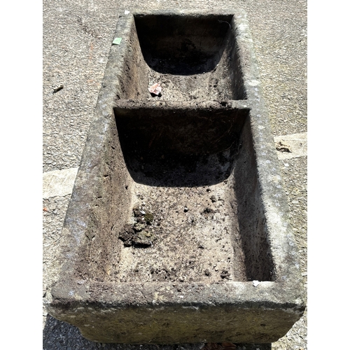 7 - A stone garden trough with twin sections, length 107cm.