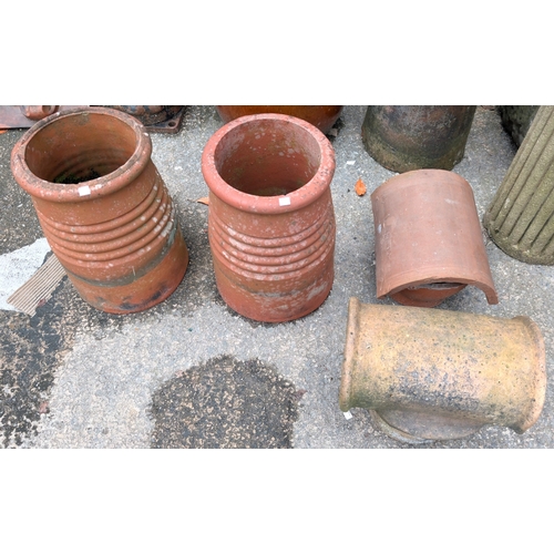 14B - A pair of early 20th century terracotta chimney pots/planters with covers