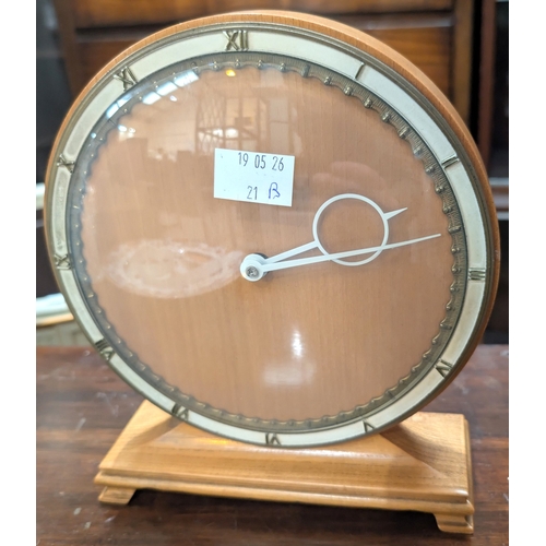21B - A Bauhaus design Art Deco circular lightwood mantel clock designed by Heinrich Moller for Kienzle th... 