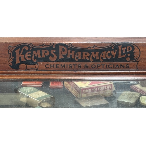20 - A rare 19th/early 20th century apothecary cabinet baring Kemps Pharmacy Ltd logo with contents.
