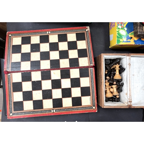 41 - A cased wooden chess set and various games.