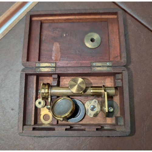 11B - A 19th century miniature/travel microscope in mahogany case