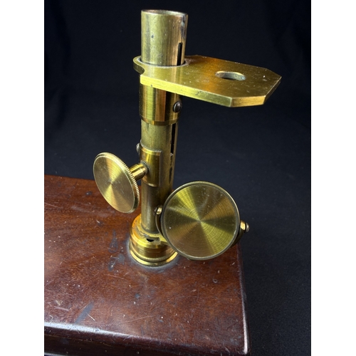 11B - A 19th century miniature/travel microscope in mahogany case