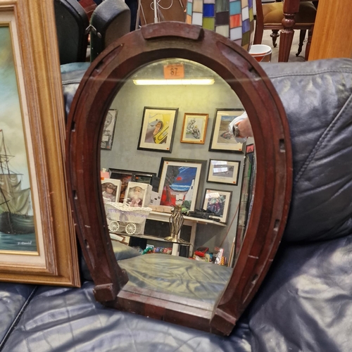 87 - A Horse Shoe Framed Mirror