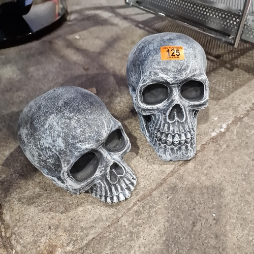 125 - Pair Of Concrete Skulls