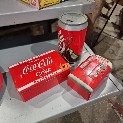 250 - 2 Coca Cola Tins & Money Box