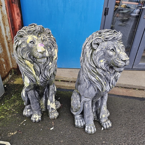 705 - A Pair Of Large Lion Ornaments