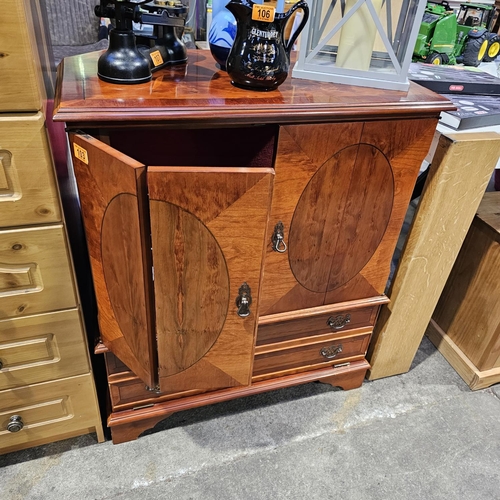 103 - A Mahogany Folding Door Drinks Cabinet