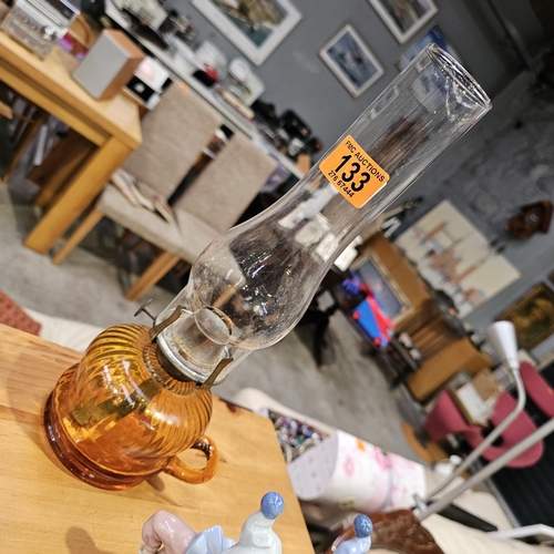 133 - An Amber Glass Bowl Oil Lamp