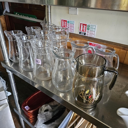 563 - Shelf Lot Of Glass Jugs