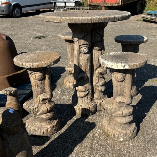 73A - An Ornate Concrete High Garden Table & 4 Matching High Stools, Depiciting Easter Heads