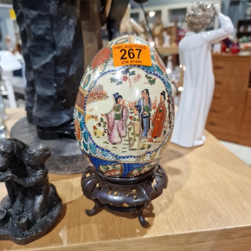 267 - A Japanese Decorative Porcelain Egg On Stand