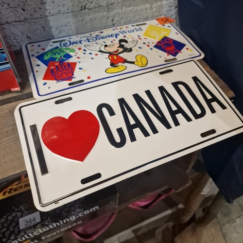 34 - 2 Tin Signs (Canada & Walt Disney)