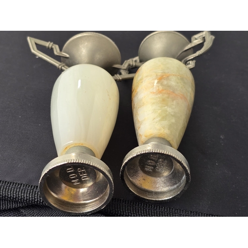 154 - Two heavy marble mantel ornaments, each topped by metal & handle,  designs and height not identical.... 