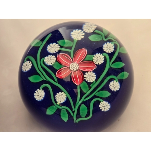 166 - Perthshire paperweight: 2001. Pink flower 7 white florets on blue Excellent condition. 74mm diam. Bo... 