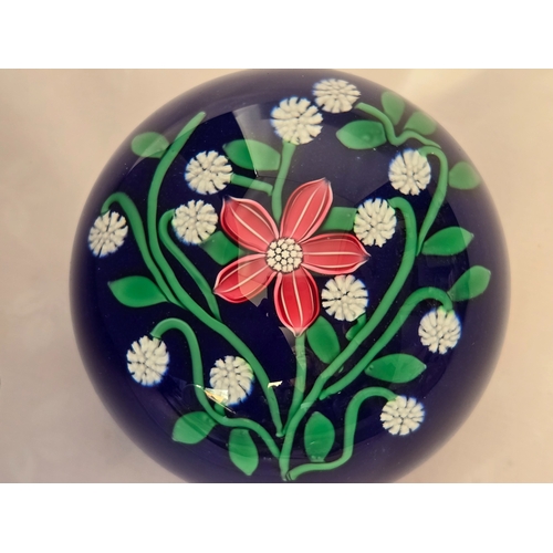 166 - Perthshire paperweight: 2001. Pink flower 7 white florets on blue Excellent condition. 74mm diam. Bo... 