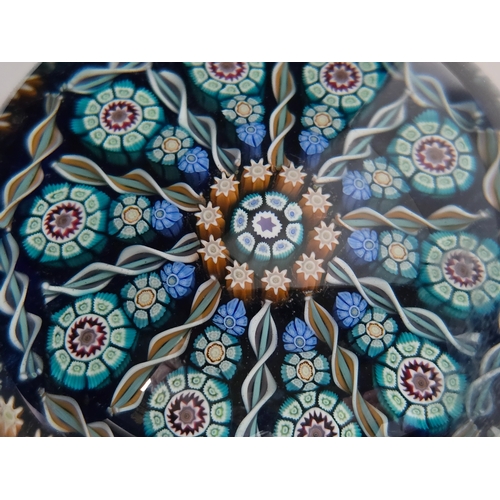 170 - Perthshire paperweight: PP72. Attractive pattern of canes and radial spokes. Translucent blue ground... 