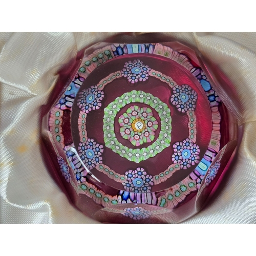 171 - Perthshire Paperweight: PP77. Pretty medium Patterned millefiori weight on translucent pale ruby gro... 