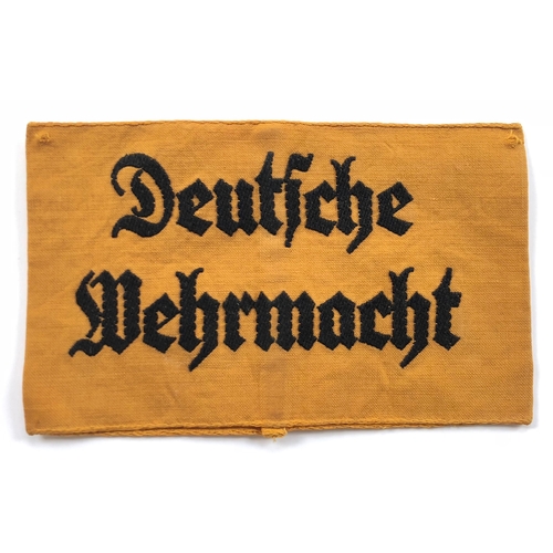 318 - German Third Reich. Deutsche Wehrmacht armband.  Good yellow cotton armband with back embroidered “D... 